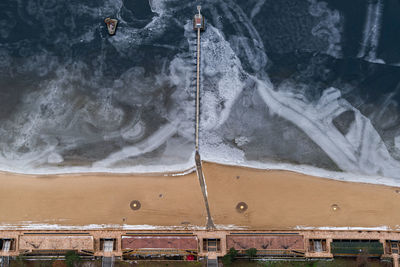 High angle view of people by sea