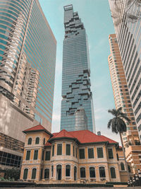 Low angle view of modern buildings against sky