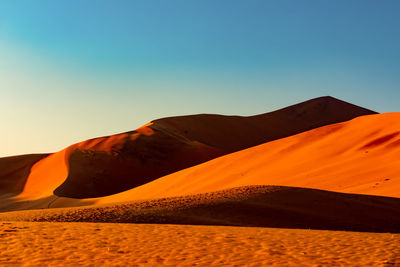 Scenic view of desert against clear sky