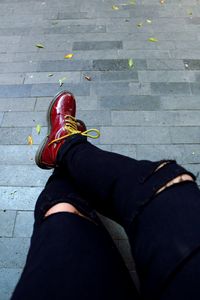 Low section of man wearing shoes