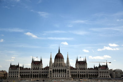 Buildings in city against sky