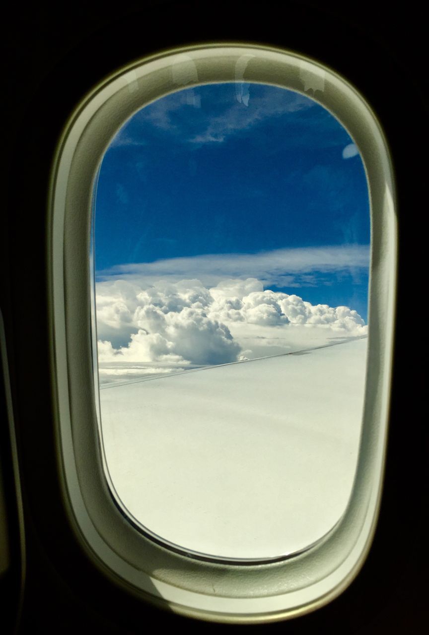 SCENIC VIEW OF SKY SEEN THROUGH AIRPLANE WINDOW