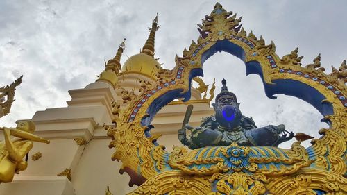 Low angle view of statue against sky