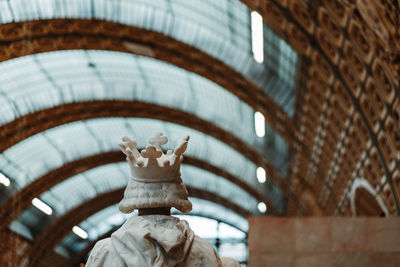 Low angle view of statue against building