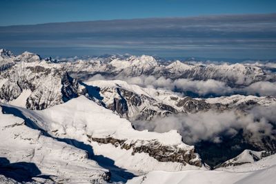 Scenic view of snowcapped mountains against sky