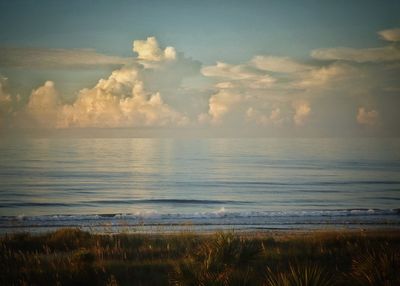 View of calm beach against the sky