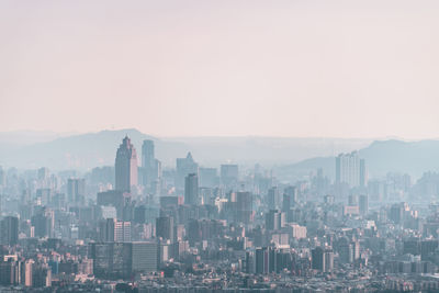 Modern buildings in city against sky