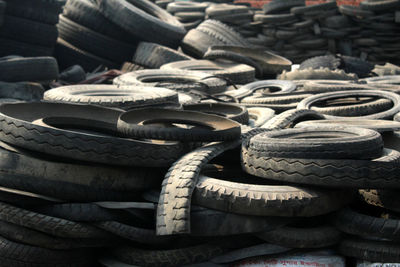 Full frame shot of stacked tires at junkyard