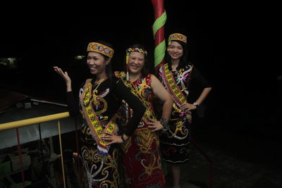 Young couple standing in traditional clothing