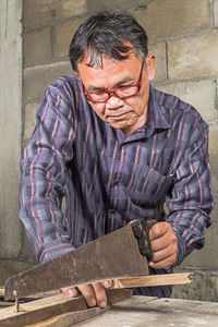 Carpenter working in carpentry workshop