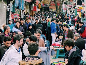 People shopping in market at city