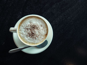 Directly above shot of cappuccino on table