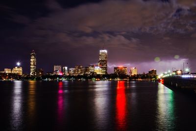 Illuminated city at waterfront