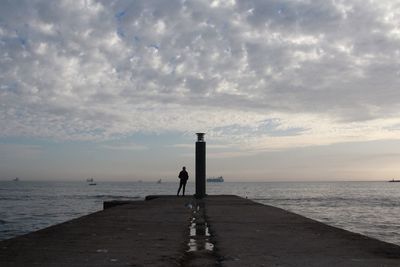 Scenic view of sea against cloudy sky