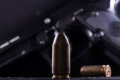 Close-up of bullets and gun