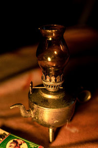 Close-up of old electric lamp on table