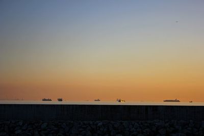 Scenic view of sea against orange sky