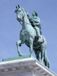 Low angle view of frederico quinto equestrian statue against sky