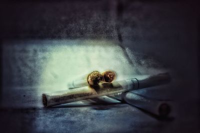 Digital composite image of cigarette on table