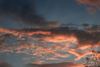 Low angle view of dramatic sky during sunset