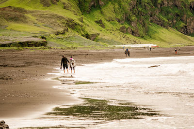 People walking on beach