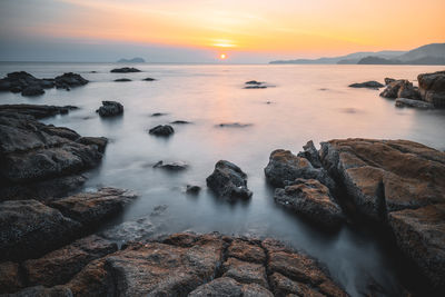 Scenic view of sea against sky during sunset