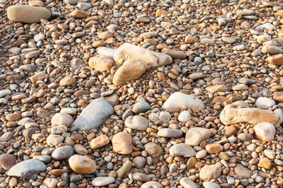 High angle view of pebbles on beach