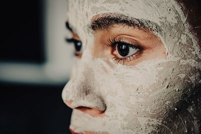 Cropped image of teenage girl with facial mask