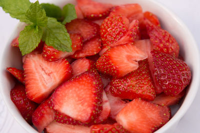 High angle view of chopped strawberries in bowl