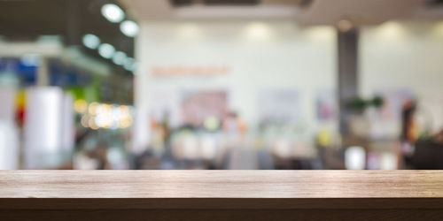 Defocused image of empty chairs and table in restaurant