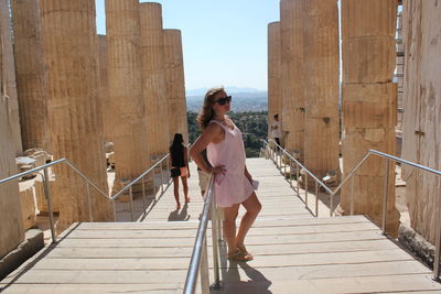 Woman standing on staircase