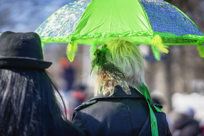 Rear view of women at st patricks day parade