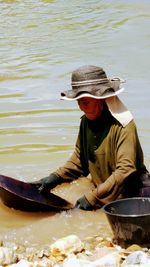 High angle view of woman working in sea