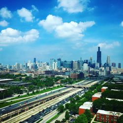 Cityscape against cloudy sky