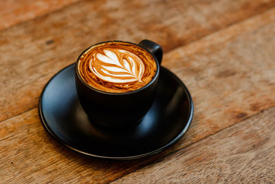 High angle view of cappuccino on table