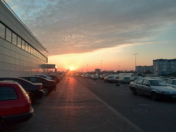 View of city street at sunset