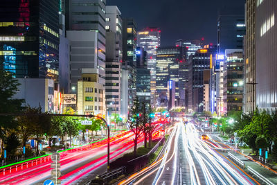 High angle view of light trails on city at night