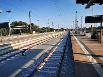 Railroad station platform against sky