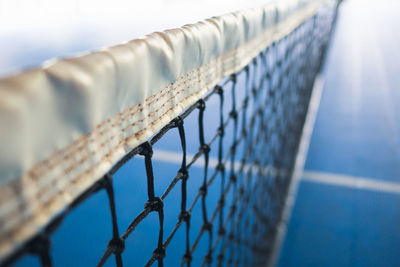 Close-up of metallic structure against sky