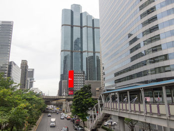 Modern buildings in city against sky