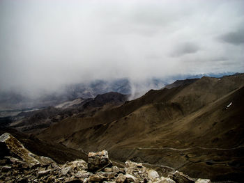 Scenic view of himalayas against cloudy sky