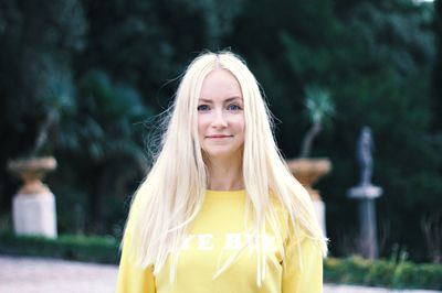 Portrait of a smiling young woman standing outdoors