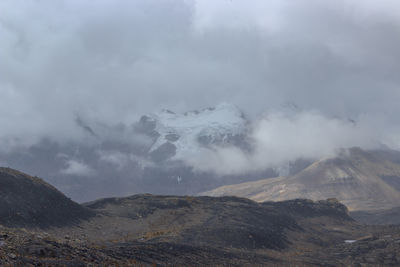 Scenic view of volcanic mountain against sky