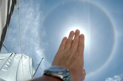 Low section of person against sky