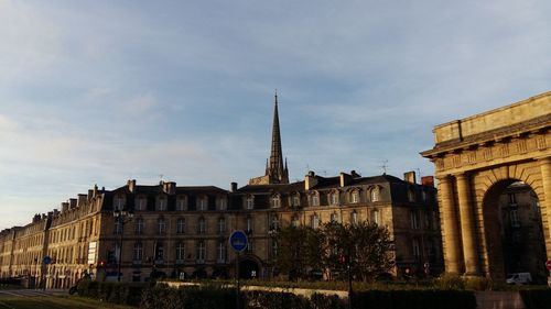 Low angle view of church against cloudy sky