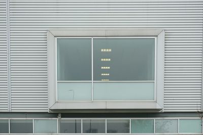 Reflection of building on glass window