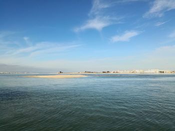 Scenic view of sea against blue sky