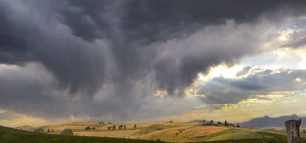 Panoramic view of storm clouds over land