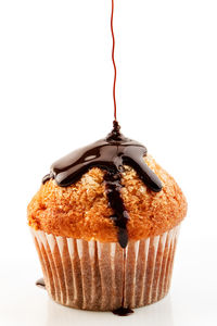 Close-up of chocolate cake against white background