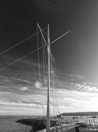 Low angle view of bridge over sea against sky